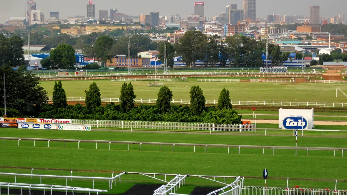Turffontein Racecourse in Johannesburg with the city skyline behind